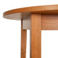 Classic Shaker Round Solid Top Dining Table featuring a smooth round tabletop edge and two straight solid hardwood legs.