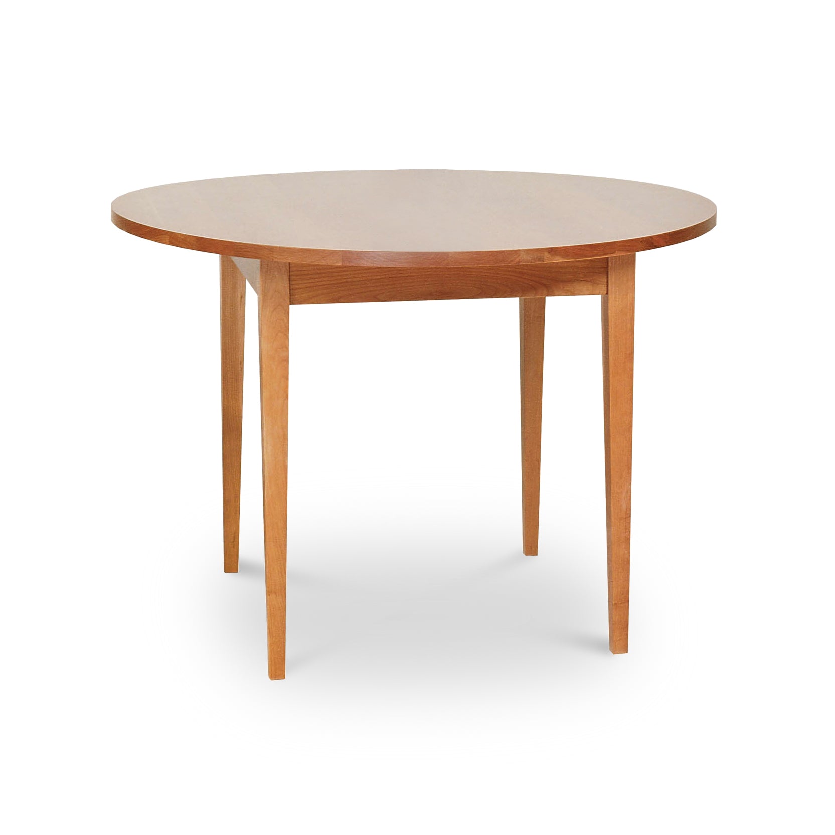 A Classic Shaker Round Solid Top Dining Table, handmade by Lyndon Furniture in Vermont, with wooden top and legs.