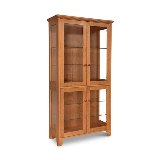 A handcrafted Classic Vermont Curio Cabinet with glass doors, sustainably made by Lyndon Furniture in Vermont.