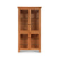 A handcrafted Lyndon Furniture Classic Vermont curio cabinet made from sustainable wood, featuring glass doors.