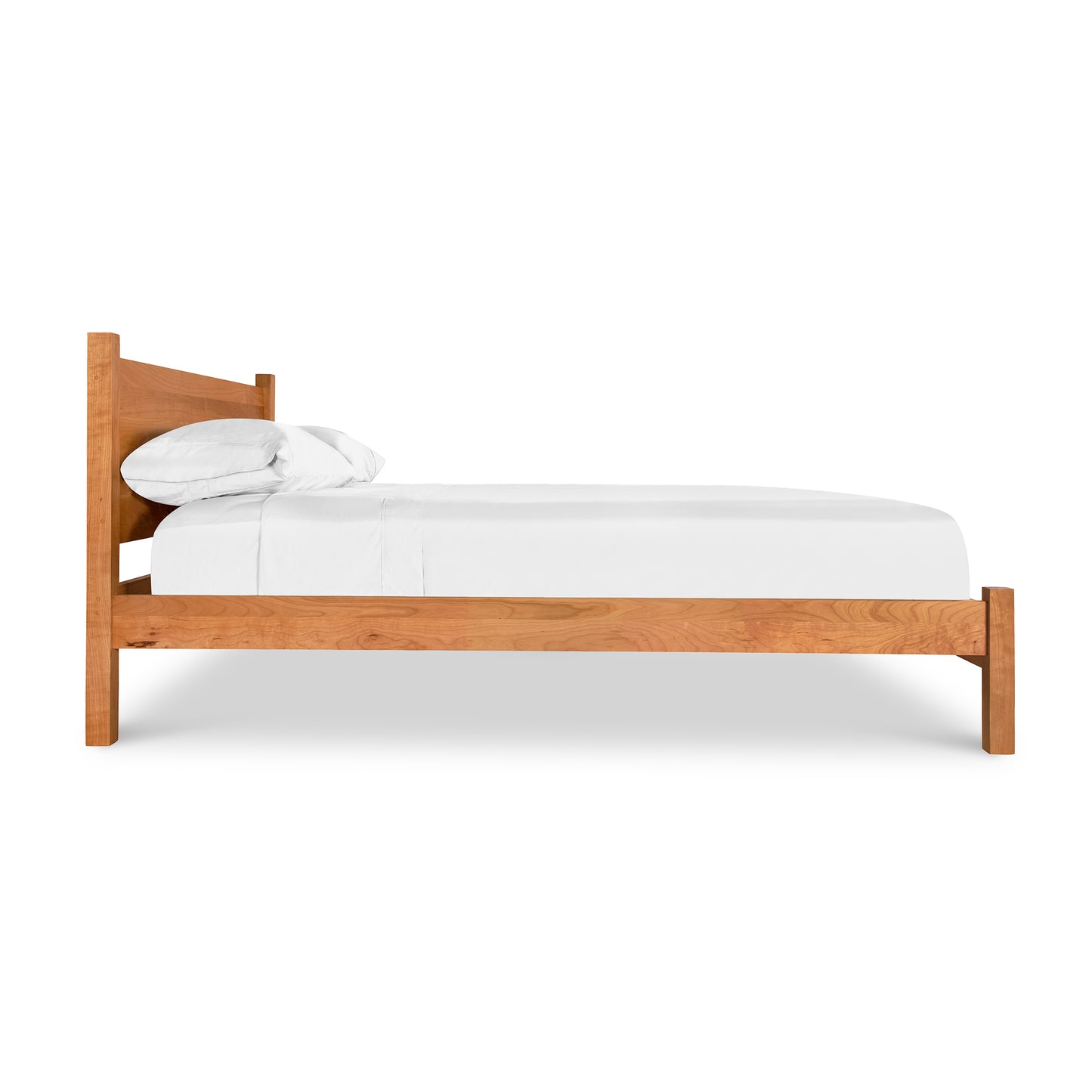 A Classic Wood Bed by Lyndon Furniture with white sheets on it.