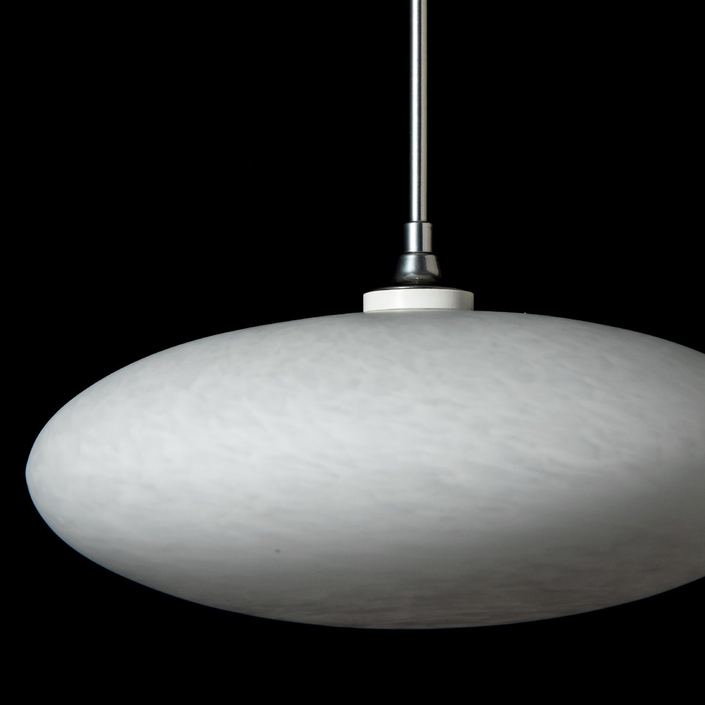 Round white Hubbardton Forge Clouds Low Voltage Mini Pendant suspended from a slim rod, showcasing elegant modern lighting design.