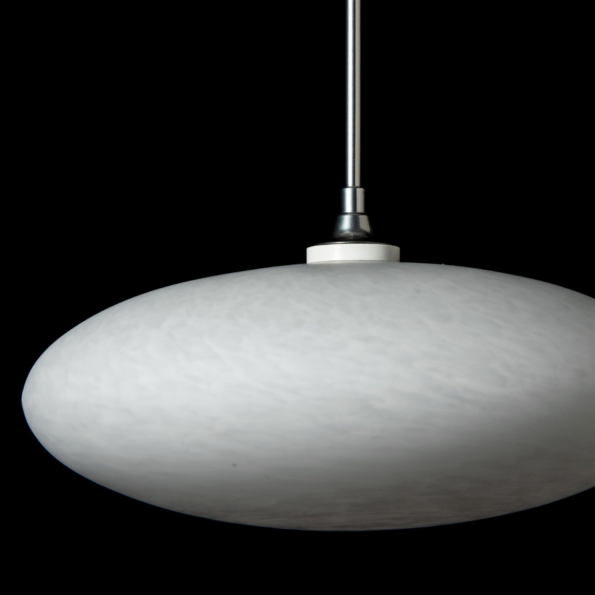 Round white Hubbardton Forge Clouds Low Voltage Mini Pendant suspended from a slim rod, showcasing elegant modern lighting design.