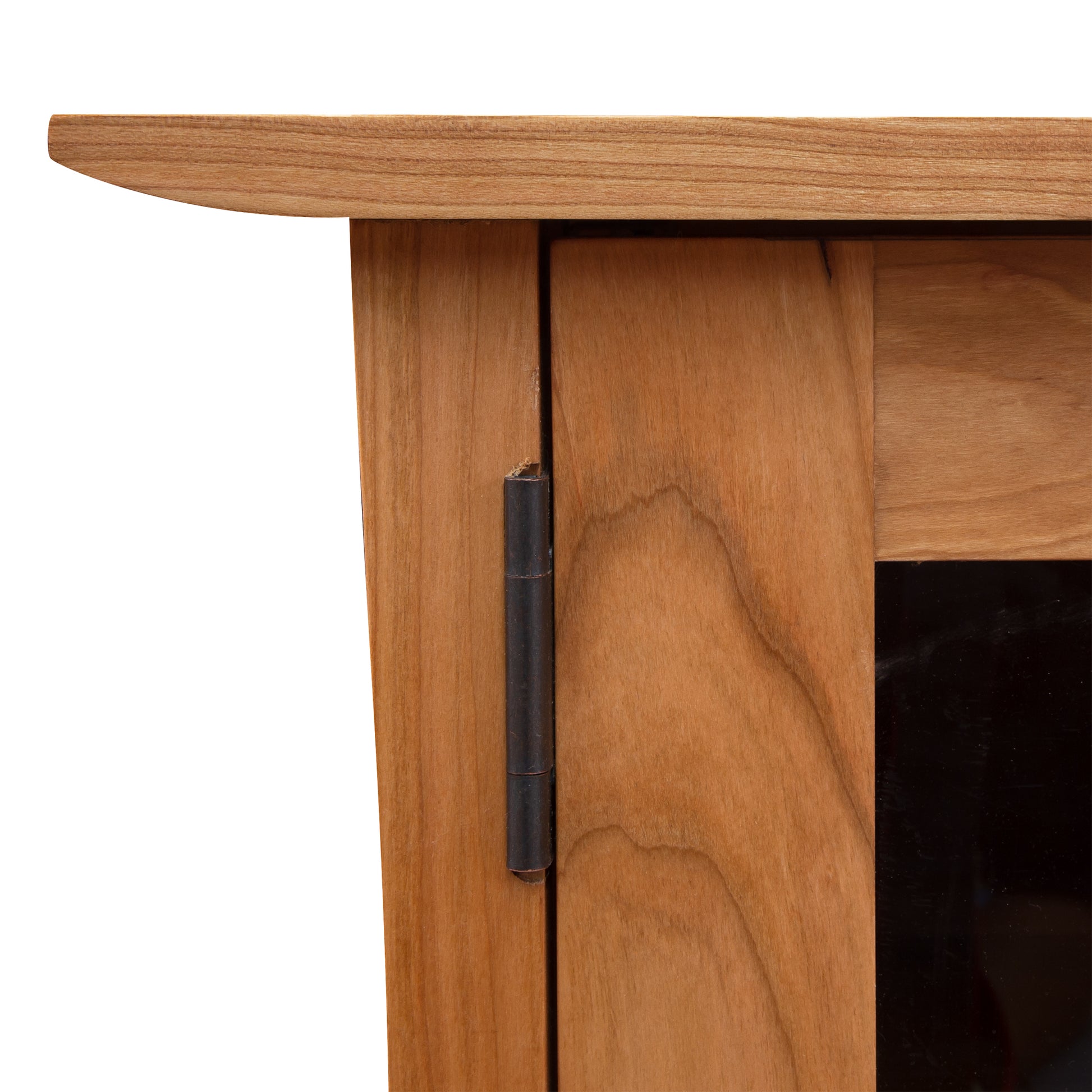 Close-up of a Vermont Furniture Designs Contemporary Craftsman 3-Drawer Media Console corner showing a detailed view of the table's edge and hinge, set against a white background.