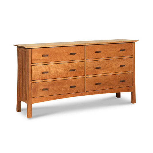 A Vermont Furniture Designs Contemporary Craftsman 6-Drawer Dresser featuring six drawers—three smaller drawers aligned horizontally on top of three larger drawers. This dresser has a simple, sturdy design with slightly tapered legs and walnut drawer pulls.