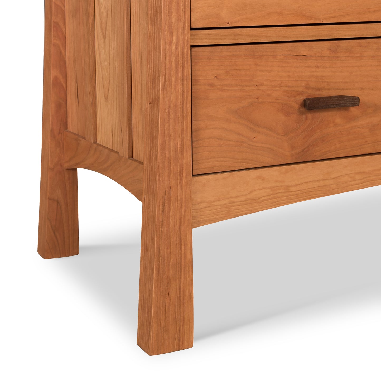 Solid Vermont Furniture Designs chest highlighting contemporary Craftsman craftsmanship, with visible grain patterns and four elegantly handled drawers on sturdy legs, enhanced by an eco-friendly oil finish.