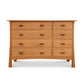 Contemporary Craftsman 8-Drawer Dresser with simple handles, natural wood finish, and short legs crafted by Vermont Furniture Designs.