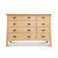 Contemporary Craftsman 8-drawer dresser by Vermont Furniture Designs featuring dark handles, expertly crafted from solid wood.