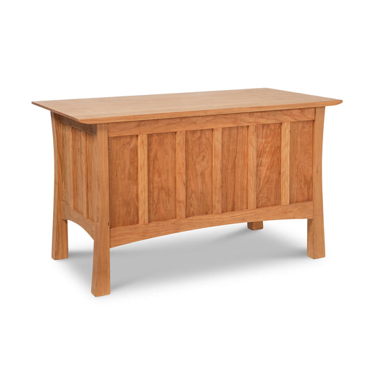 A solid wood Vermont Furniture Designs Contemporary Craftsman blanket chest with a hinged top and paneled sides, finished with eco-friendly oil, on a white background.