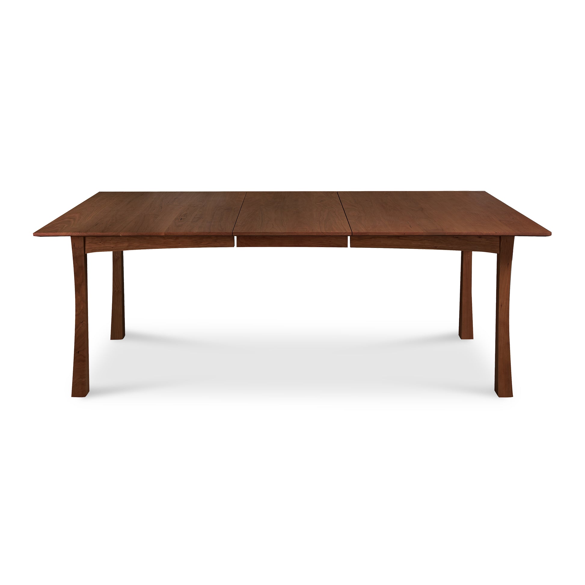A Contemporary Craftsman Extension Dining Table with extendable leaves, handcrafted by Vermont woodworkers from Vermont Furniture Designs, against a white background.