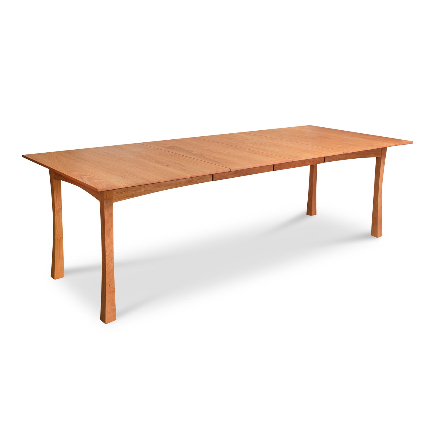 A Vermont Furniture Designs Contemporary Craftsman Extension Dining Table, crafted by Vermont woodworkers, featuring a wooden rectangular shape with an extended leaf on a white background.