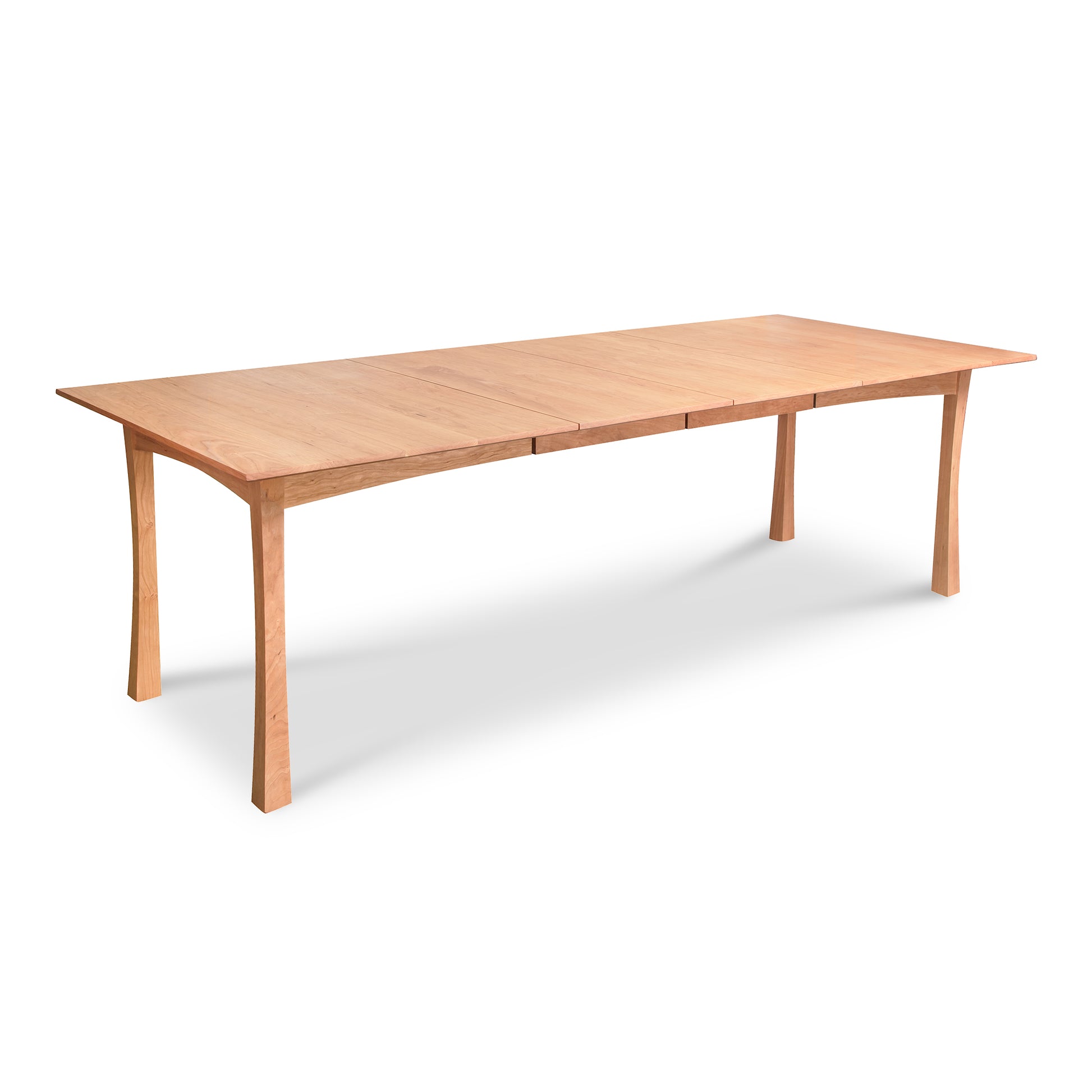A Contemporary Craftsman Extension Dining Table with a simple design on a white background, crafted by Vermont Furniture Designs woodworkers.