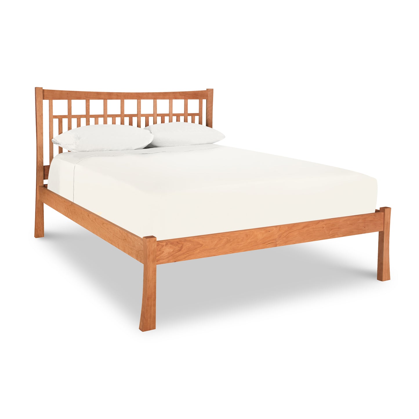 A Contemporary Craftsman Low Footboard Bed from the Vermont Furniture Designs bedroom collection with a white mattress and two pillows against a white background.