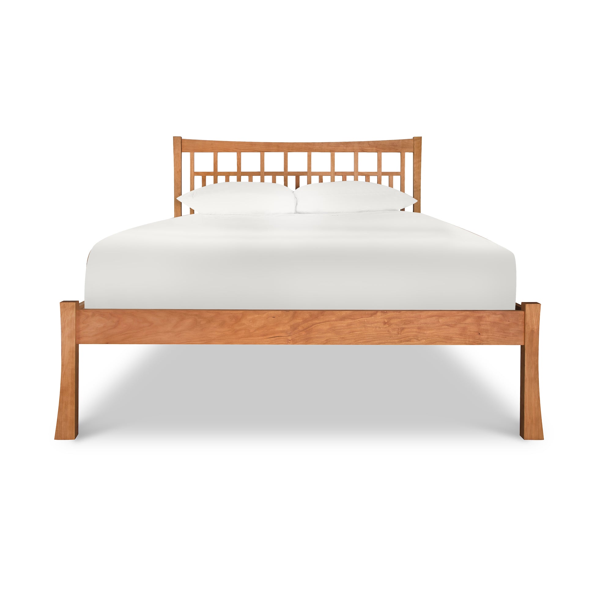 A Vermont Furniture Designs Contemporary Craftsman Low Footboard Bed, with a white mattress, isolated on a white background.