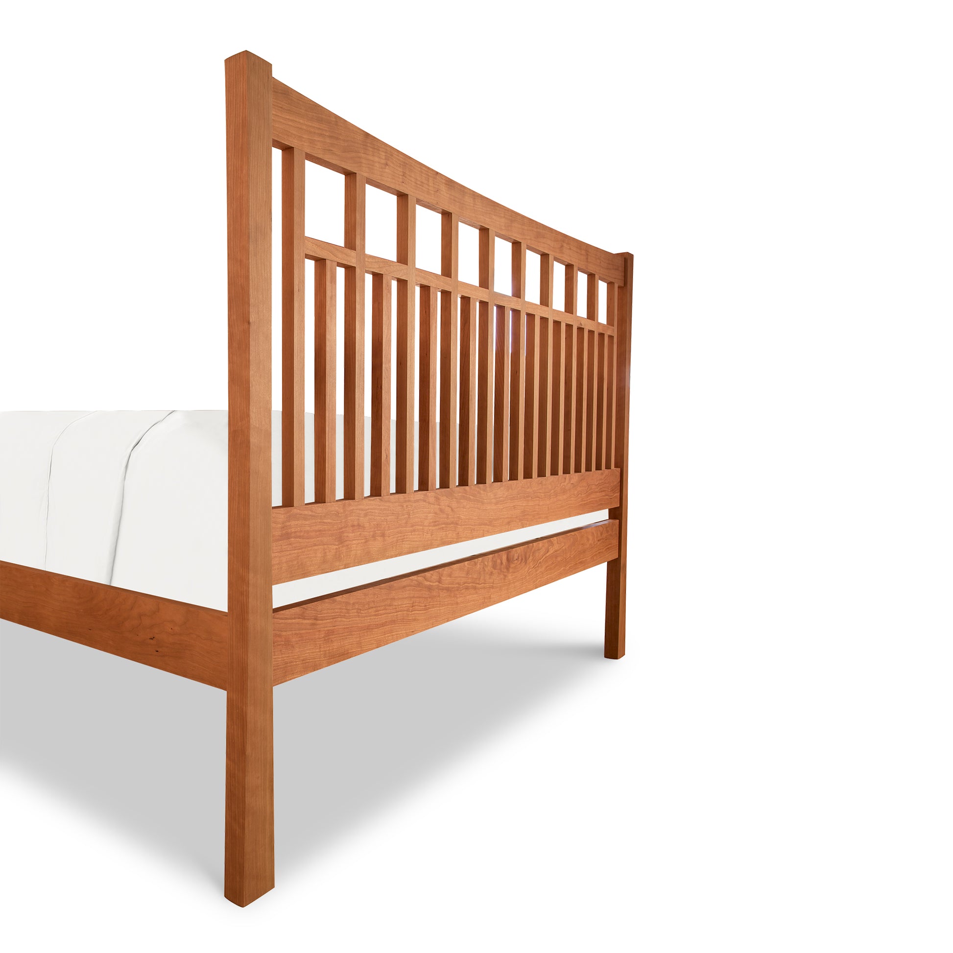 A Vermont Furniture Designs Contemporary Craftsman Low Footboard Bed with slats, featuring one white mattress, isolated on a white background.