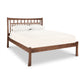 Contemporary Craftsman Low Footboard Bed by Vermont Furniture Designs in solid wood with slatted headboard, mattress, and pillows.