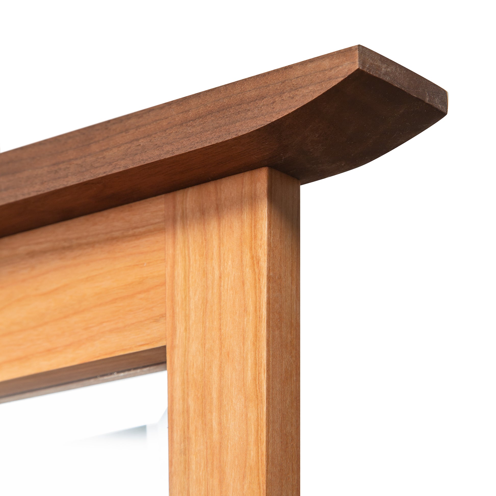 Vermont Furniture Designs Contemporary Craftsman Mirror featuring a handcrafted hardwood frame and elegant upward-curved edge.