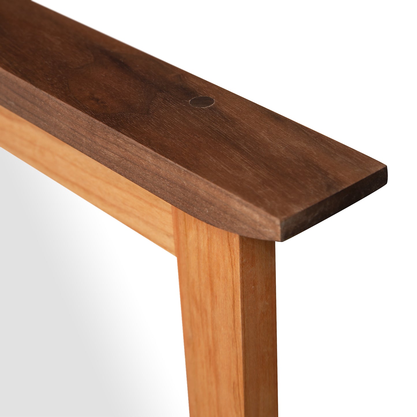 Contemporary Craftsman Mirror by Vermont Furniture Designs with a dark brown top edge and lighter wood sides, highlighting premium craftsmanship.