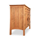 Vermont Furniture Designs Contemporary Craftsman Sideboard with panel detailing, brass hinges, two drawers, and a door shown from the side.