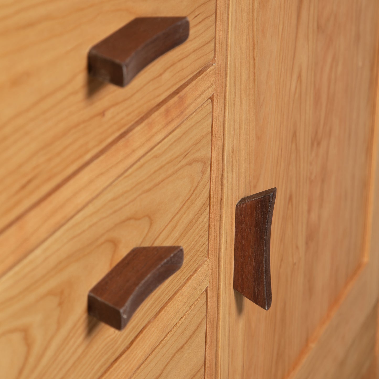 Contemporary Craftsman Sideboard by Vermont Furniture Designs with two drawers and a door, accented by dark curved handles, American-made quality.