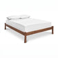 Contemporary Craftsman Studio-Style Platform Bed by Vermont Furniture Designs with mattress and pillows, showcasing quality American craftsmanship.
