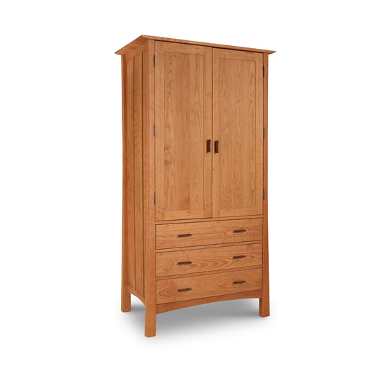 A Vermont Furniture Designs contemporary Craftsman tall armoire with two doors and three drawers, isolated on a white background.