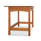Contemporary Craftsman Writing Desk with an angled leg support and eco-friendly oil finish, isolated on a white background, by Vermont Furniture Designs.