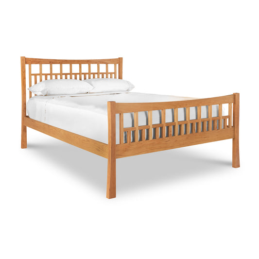 A Vermont Furniture Designs Contemporary Craftsman High Footboard Bed with slatted headboard and footboard, made up with white bedding, isolated on a white background, features an eco-friendly oil finish.