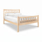Contemporary Craftsman High Footboard Bed by Vermont Furniture Designs with vertical slats, white bedding, and two accent pillows.
