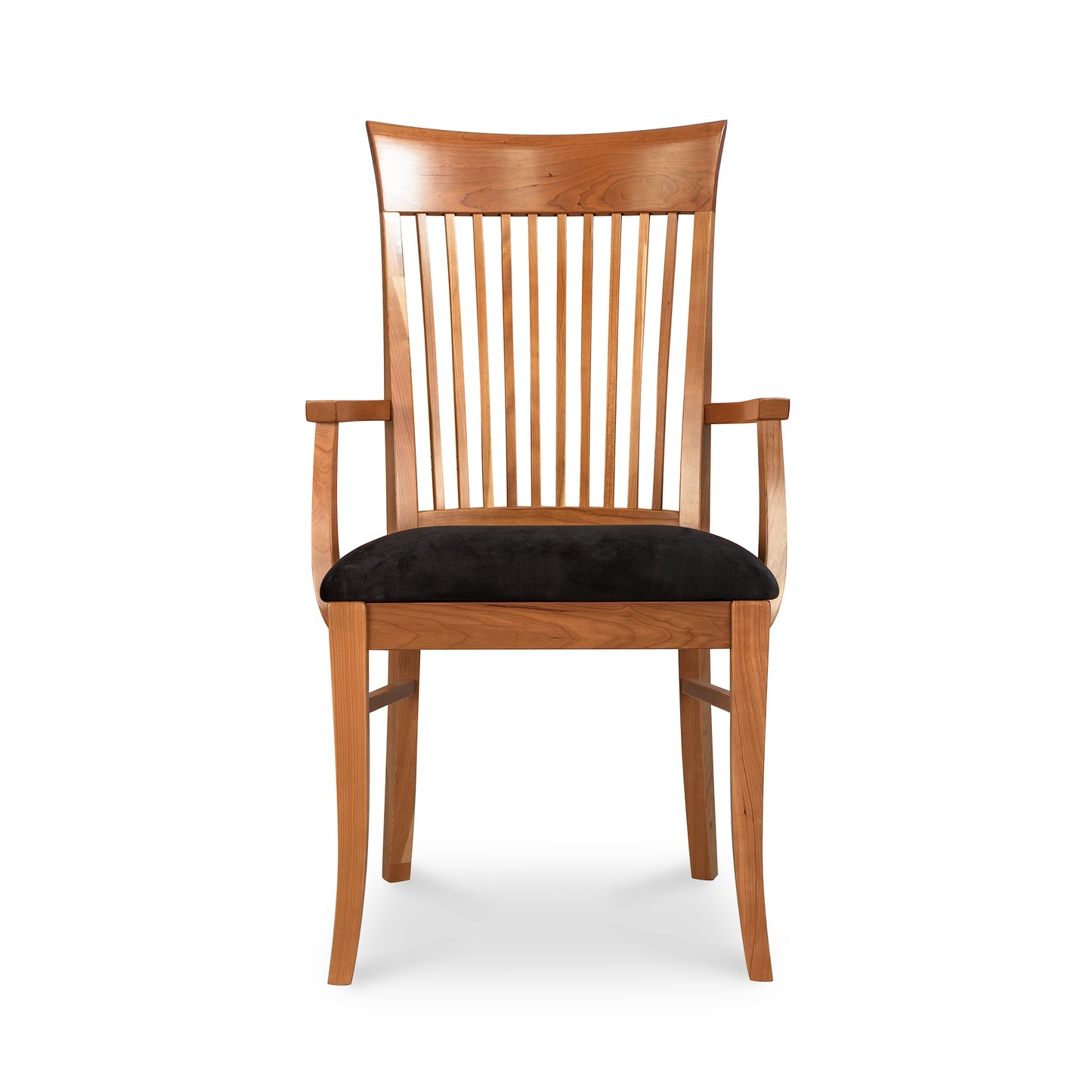 A natural cherry Vermont Woods Studios Contemporary Shaker Chair with vertical slats on the backrest and black upholstered seat cushion, isolated against a white background.