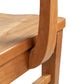 A close up view of a wooden chair.