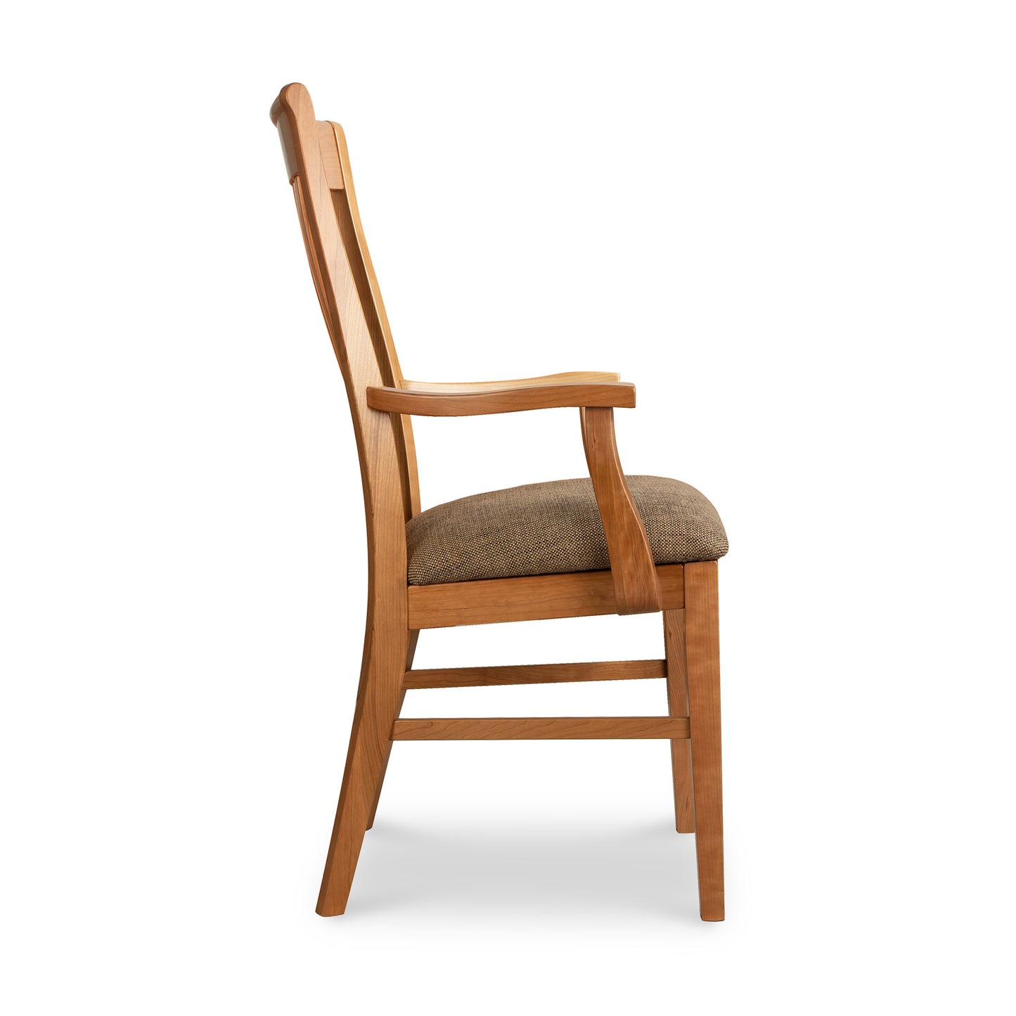 A wooden dining chair with a brown upholstered seat.
