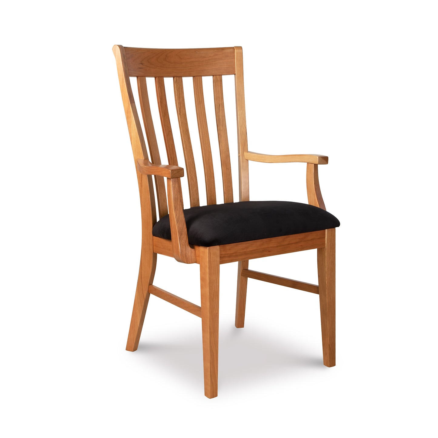 A wooden dining chair with a black cushion.