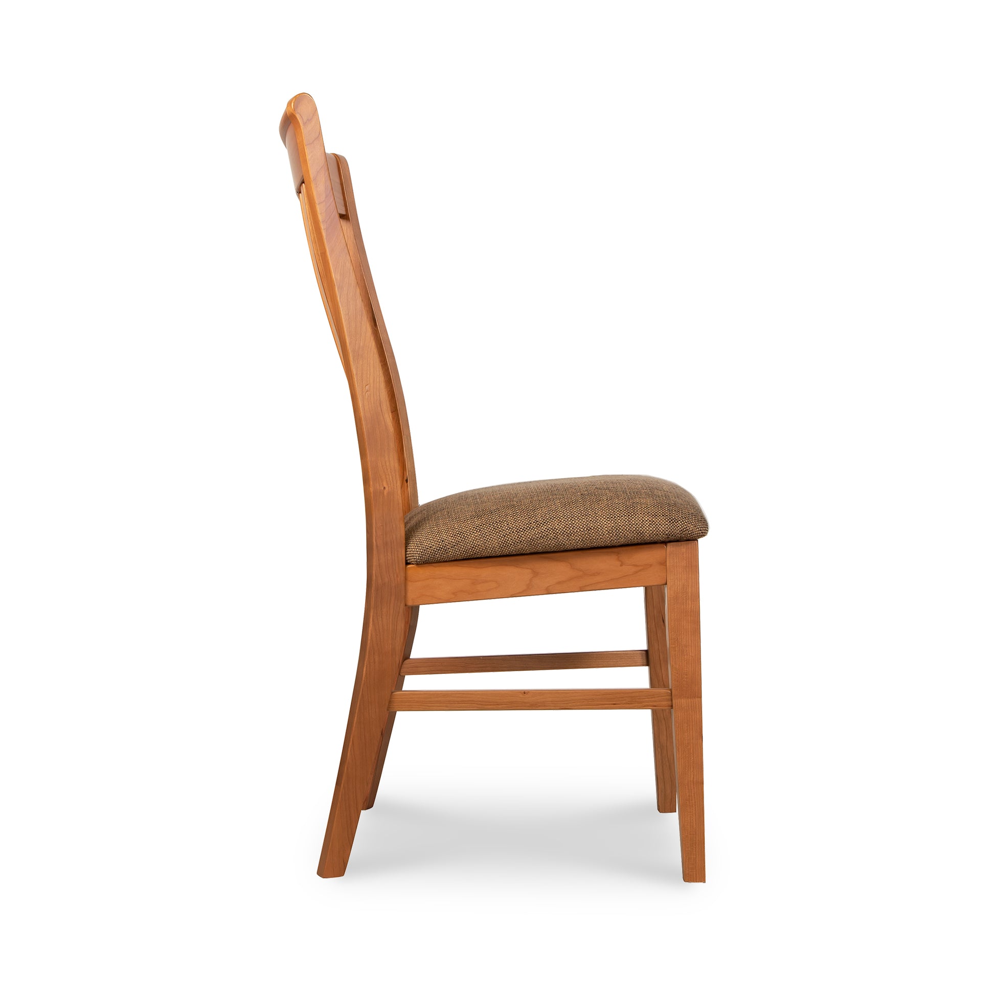 A wooden dining chair with a tan seat.