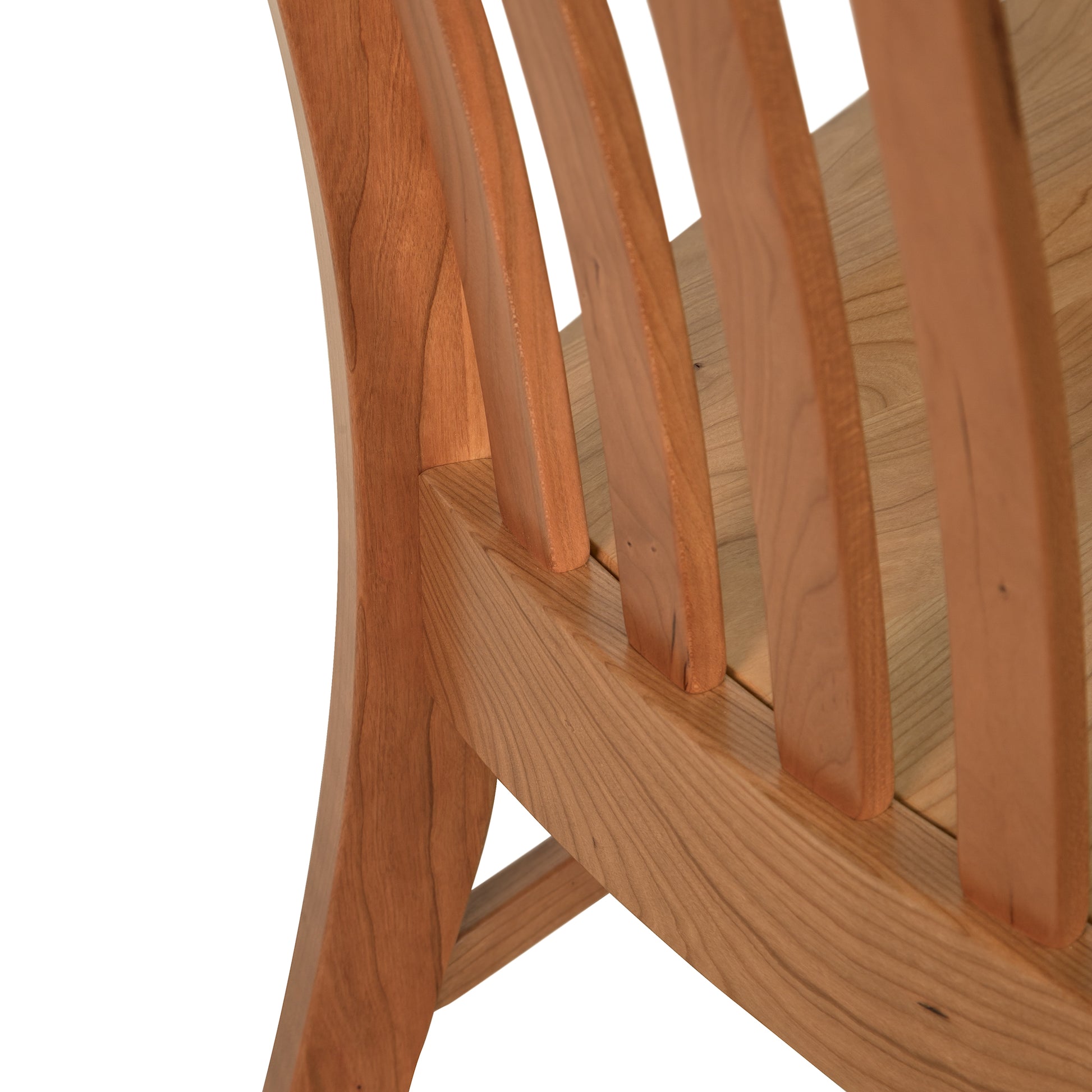 Close-up view of a Vermont Woods Studios Country Shaker Chair with Wood Seat showing detail of the seat and backrest slats with a focus on the joinery and wood grain.