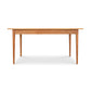 A minimalist design featuring a natural wood top, rectangular shape, and four tapered legs describes the Country Shaker Dining Table by Vermont Woods Studios. This dining table measures 36"x60" and has a plain white background, showcasing its natural wood finish. Note that this is a discontinued design and ready to ship.