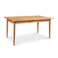 The Vermont Woods Studios Country Shaker Dining Table - 36"x60" - Discontinued Design - Ready to Ship features a natural wood top and four straight, tapering legs. Its wooden rectangular design boasts a natural wood finish, exuding rustic charm. This customizable dining table is beautifully set against a plain white background.