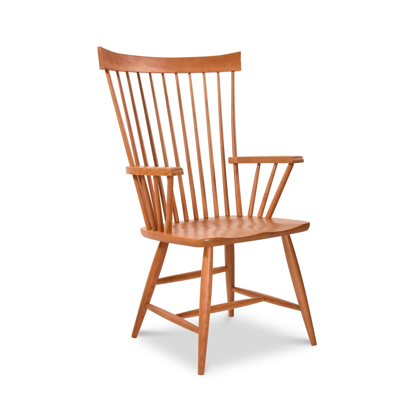 A high-end Country Windsor Chair by Lyndon Furniture, with a contemporary flair, featuring a wooden seat and arms.