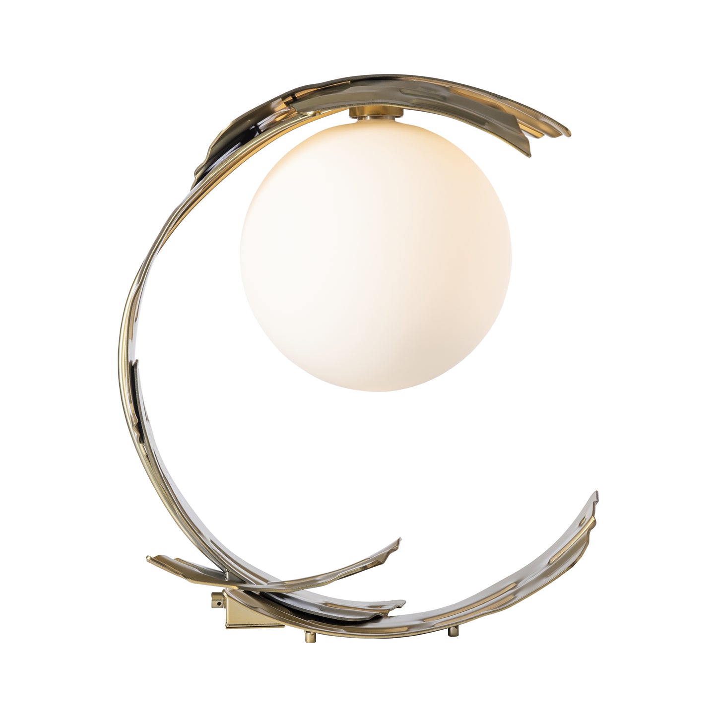 Crest Table Lamp by Hubbardton Forge featuring a circular design with a glowing white sphere encased in a crescent-shaped, curved metallic hand-forged steel structure with a modern brass finish.