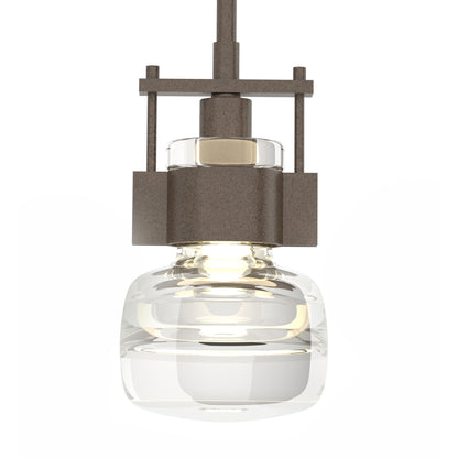 Hubbardton Forge Cuff Large Mini Pendant showcases handcrafted American metalwork and a clear glass shade, highlighting its quality and modern design.