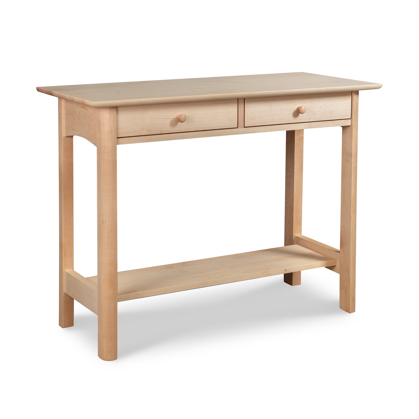 The handcrafted Custom Heartwood Shaker 2-Drawer Console Table in maple from Vermont Furniture Designs features a light finish and includes two small drawers with round wooden knobs, as well as an open lower shelf. Supported by four slightly tapered legs, this simple and functional piece is crafted from solid wood and currently available on clearance.