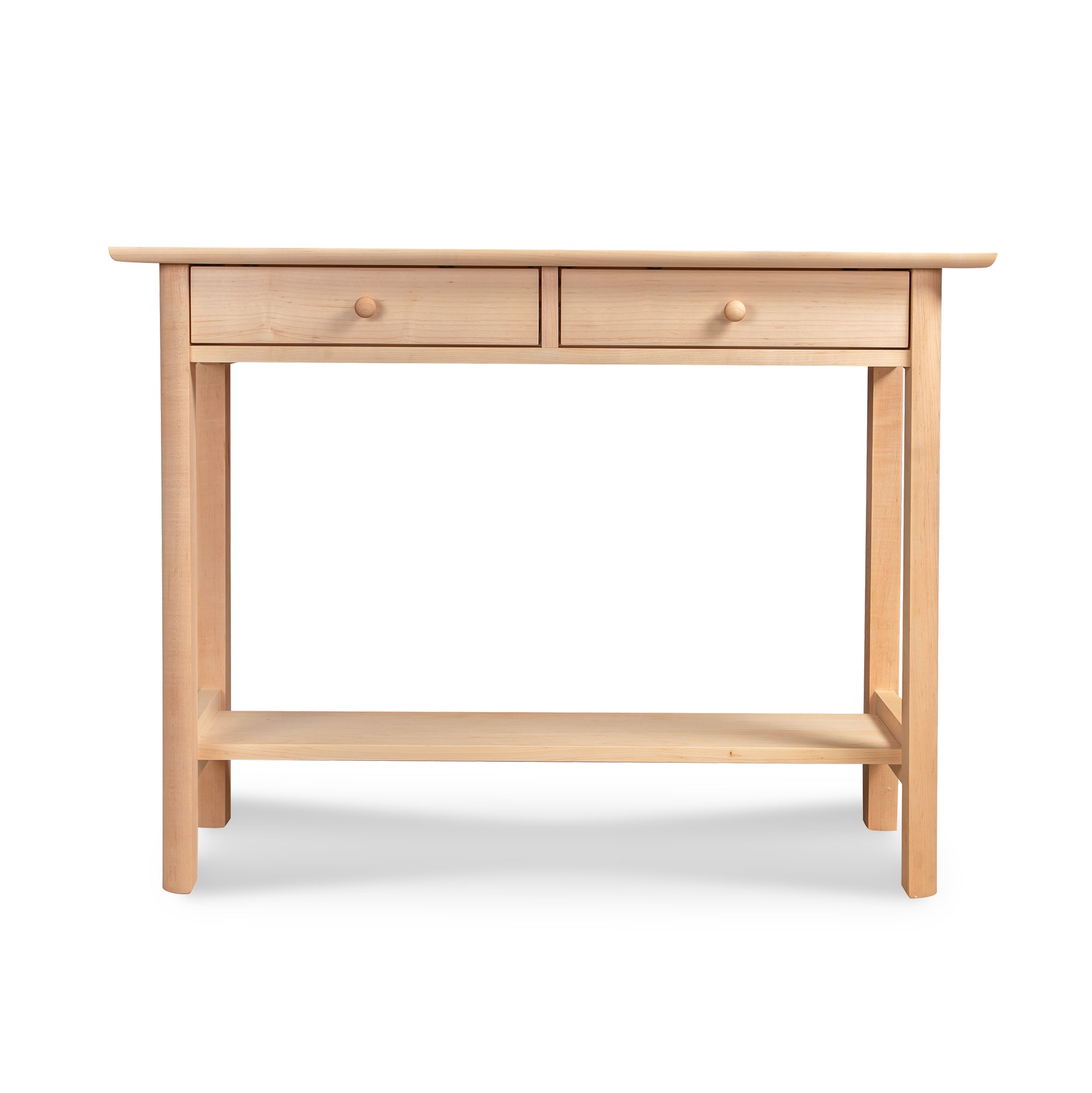 The Custom Heartwood Shaker 2-Drawer Console Table - Maple - Clearance by Vermont Furniture Designs is crafted from solid wood with a light finish. It features two drawers with round knobs and an open shelf at the bottom. Handcrafted in Vermont, this elegant table is supported by four straight legs.