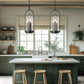 Three wooden counter stools positioned at a white kitchen island, showcasing American craftsmanship and quality design.