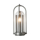 Davis Small Outdoor Sconce by Hubbardton Forge with hand-forged steel frame, clear glass dome, and single exposed bulb, highlighting its elegant craftsmanship.