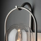 Davis Small Outdoor Sconce by Hubbardton Forge, showcasing hand-forged steel construction and a clear glass shade.