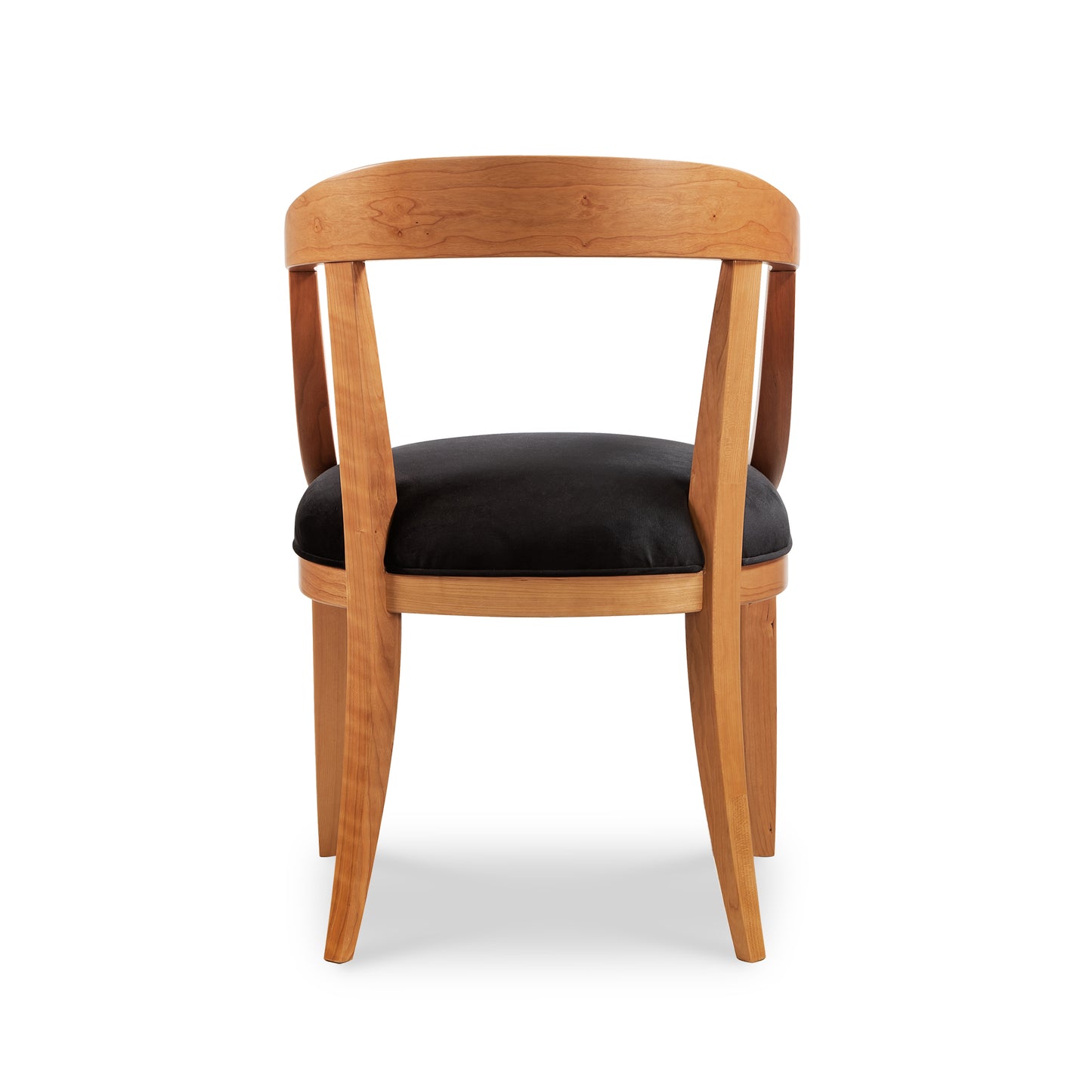 A wooden chair with black upholstered seat.