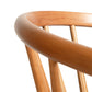A close-up image of the top portion of a Dover Curveback Windsor Chair backrest, featuring smooth, rounded edges and vertical wooden slats. Crafted from sustainable solid wood by Vermont Woods Studios, the chair showcases a light, natural finish against a plain white background.
