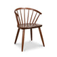 The Dover Curveback Windsor Chair from Vermont Woods Studios, crafted in the USA, highlights a curved backrest and elegant spindle supports.
