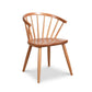Introducing the Dover Curveback Windsor Chair - Display Model from Vermont Woods Studios, crafted from sustainable solid wood. This wooden chair features a curved, ergonomic seat back with vertical slats, four angled legs, and a smooth, rounded seat. The light, polished finish adds a timeless touch to any dining space.