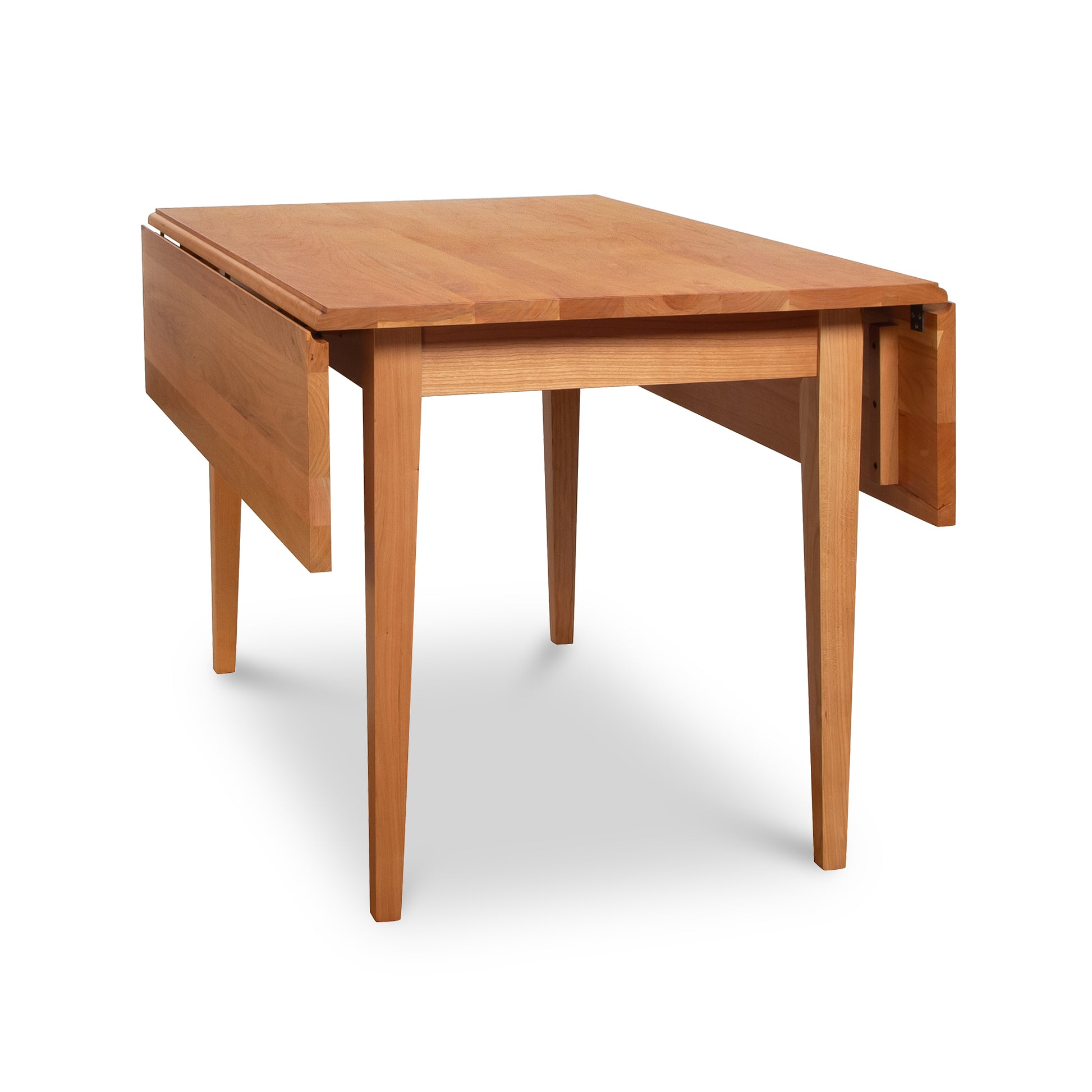 Alt text: "Solid wood Drop Leaf Table by Lyndon Furniture, handcrafted in natural cherry wood. Features extendable sides and smooth surface finish. American made craftsmanship, perfect for any space.